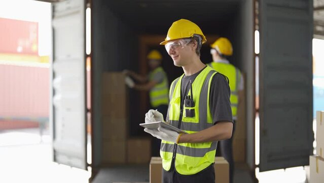 Teamwork of workers working in large warehouse retail store industry.Rack of stock storage. Interior of cargo in ecommerce and logistic concept. Depot. People lifestyle. Shipment service for container