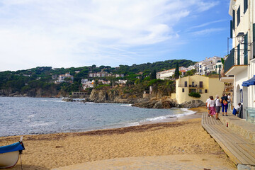 view of one of the beaches in calella de palafrugell, where the historic houses rise to the sea, Costa Brava, Girona, Catalonia, Spain