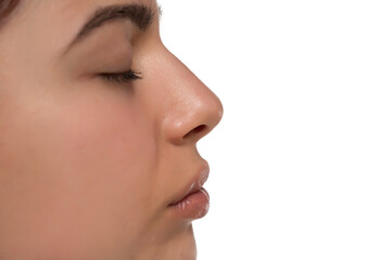 Closeup nose and mouth of a young woman on a white background