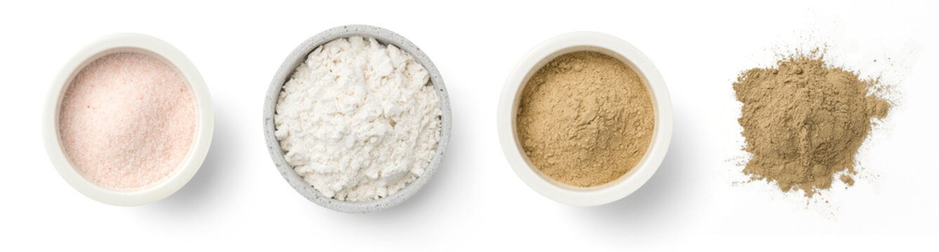 different powders / powdery substances in bowls and loose, isolated over a transparent background, natural cosmetics or ingredients, top view / flat lay