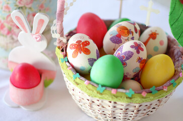 Fototapeta na wymiar Easter eggs in decorated easter basket