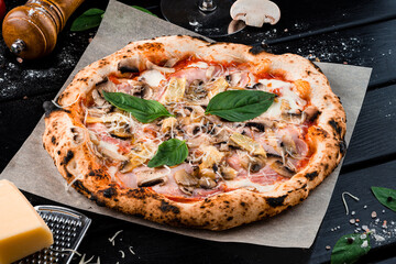 Italian food pizza with chicken ham, cheese parmesan, mozzarella, champignon mushrooms, tomato sauce and spinach on thick dough from the oven.