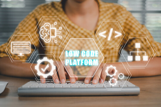Low Code software development platform technology concept, Woman hand typing on keyboard computer with Low Code software development platform icon on virtual screen.