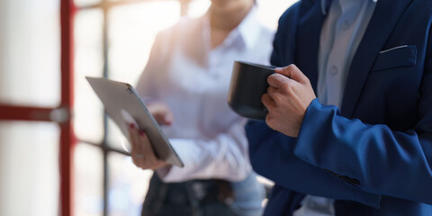 Fund managers team consultation and discuss about analysis Investment stock market by digital tablet