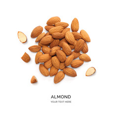 Creative layout made of almonds on the white background. Flat lay. Food concept. Macro concept. 