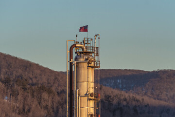 plant diesel raifinery fuel crisis, American flag in the wind 