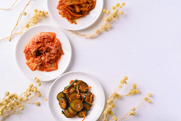 Kimchi cabbage, radish and cucumber  on white background, Korean food homemade side dish, Top view