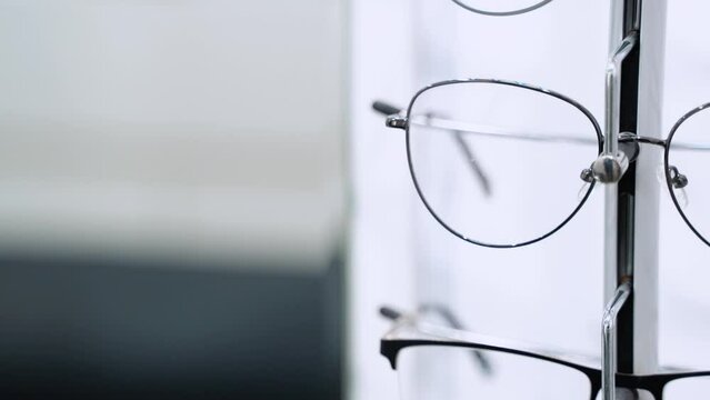 Showcase with glasses in modern optic store