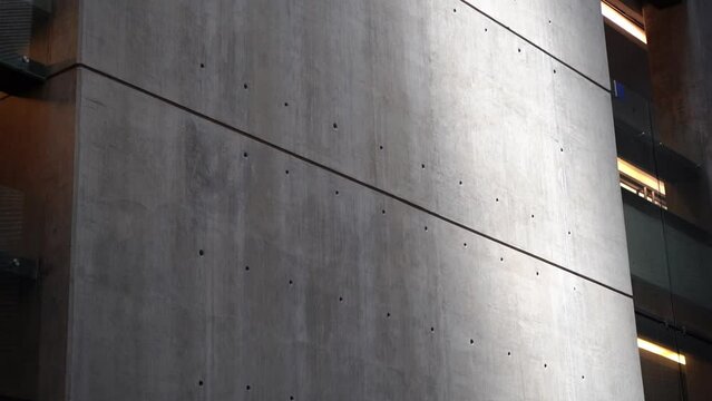 Architectural design of a modern building made of concrete, metal and glass. Architectural abstraction in motion background