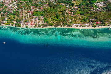 Fototapeta na wymiar Gili Air island with beach and blue ocean, aerial view. Holiday islands in Indonesia