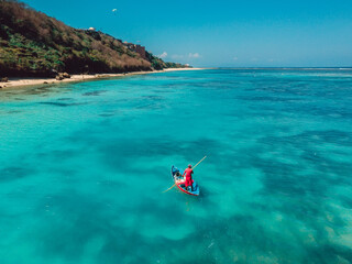 Aerial view of quiet ocean and fisherman on boat in Bali