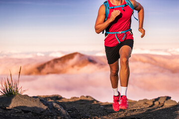 Man athlete trail running in the mountains landscape. Runner athlete training