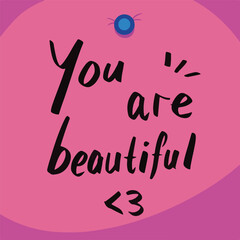 Your are beautiful, self love themed text. Hand written note with black marker on pink square paper and blue push pins decoration. Cute simple text note to not worrying. Sticky paper design.