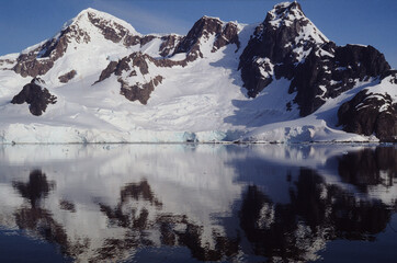 Antartic landscapes during a tripo across the Antartic peninsula with lot of icebergs, mountains...