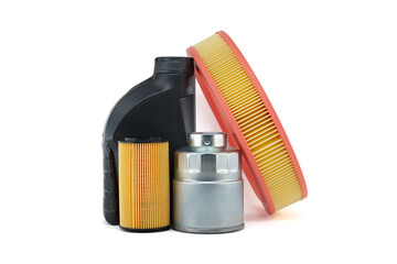 Round air, fuel and oil filters near motor oil can