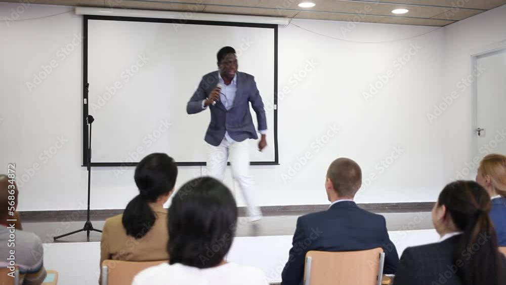 Canvas Prints portrait of cheerful successful man giving motivation training at conference hall