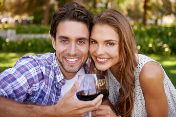 Love couple, portrait or wine toast for picnic, valentines day or romance date bonding in nature park or garden. Smile, happy woman or man and alcohol drinks glass in marriage anniversary celebration