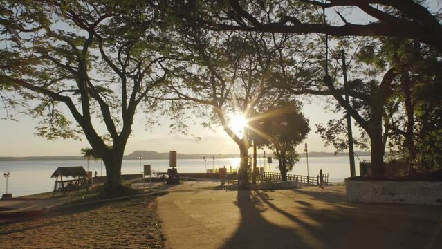 An incredible sunset through trees on a misty evening  San Bernardino , Paraguay
