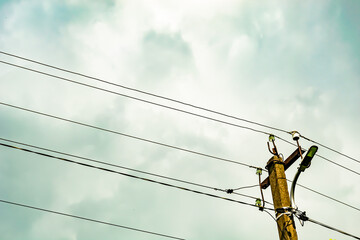 Power electric pole with line wire on colored background close up