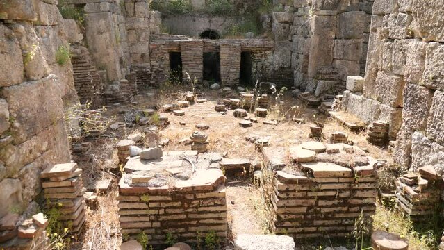 Ruins of Southern Baths of Perge. Stone columns and walls of ancient city.