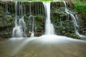 Fototapeta na wymiar waterfall in the summer river