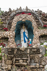 Baguio City, Philippines - Jan 2023: Our Lady of Lourdes Grotto, Catholic shrine & pilgrimage site. - obrazy, fototapety, plakaty