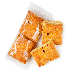 Sweet cookies in a package on a white background. A set of packed and unpacked cookies. Confectionery close-up.