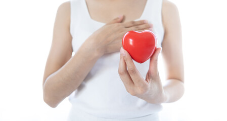 Red heart on woman hands. Symbol of support that expresses love valentine day and world heart day, heart health concept