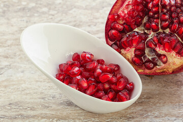 Ripe red Pomegranate seeds in the bowl