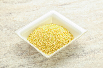 Raw couscous in the bowl