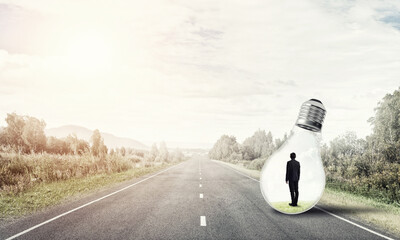 Businessman inside light bulb