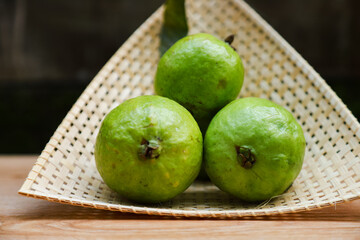 Some fresh guava on bamboo tray