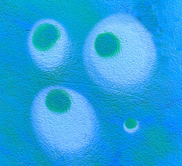 Colorful aerosol street wall background. Urban modern art texture. Wallpaper design backdrop pattern. Painted city wall close up.