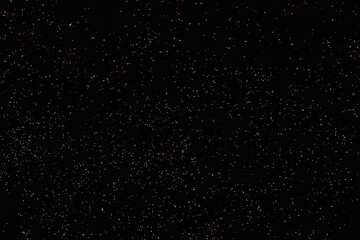 Delicate shine bokeh and particles on black backound for screen design.