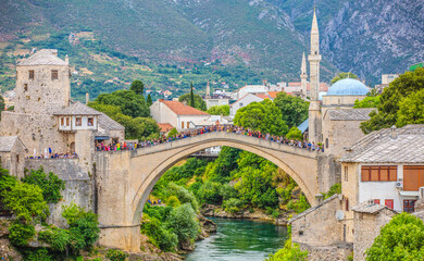 Fototapeta na wymiar Panorama of Historical Stari Most bridge over Neretva river in Mostar Old town, Balkan mountains, Bosnia and Herzegovina