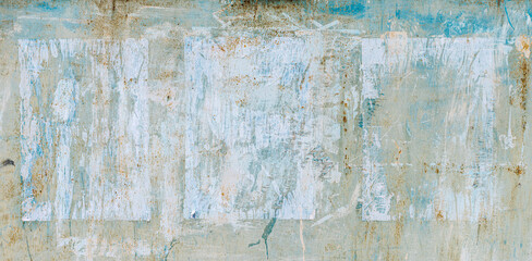 Torn Ripped Aged Paper Poster Street Wall Surface. Blue and White Colors. Leaking Paint. Grunge Rough Dirty Rust Background. Urban Collage Texture. 