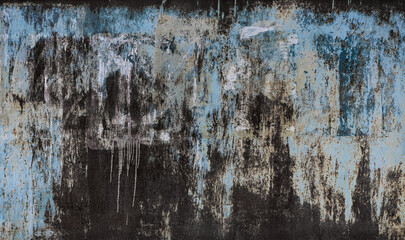 Torn Ripped Aged Paper Poster Street Wall Surface. Black and Blue Colors. Leaking Paint. Grunge Rough Dirty Rust Background. Urban Collage Texture.