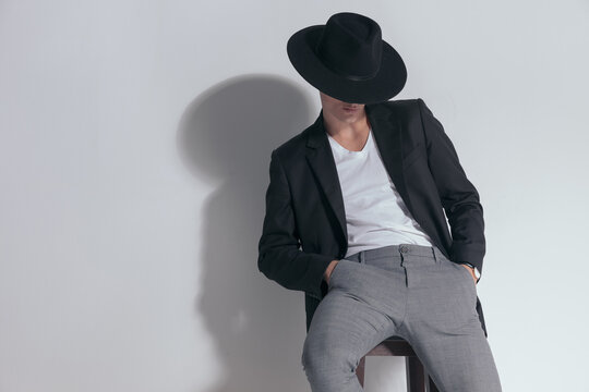 Portrait of young smart casual man posing with a mysterious vibe,