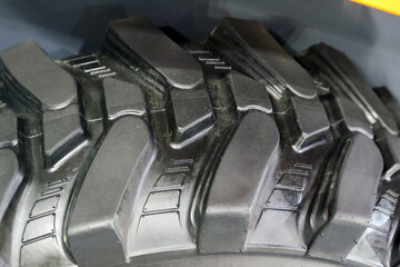 Fototapeta premium Tread tire of a tractor. Harvester close-up
