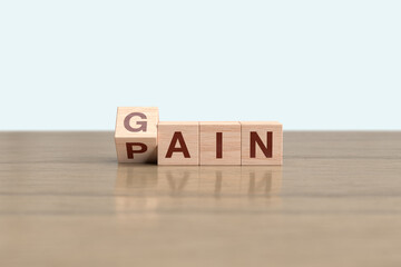 Wooden block cube flipping PAIN to GAIN