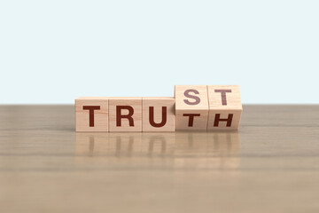 Wooden block cube flipping TRUTH to TRUST
