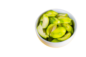 Fresh Elaeocarpus hygrophilus fruit heap and cut in half in white cup isolated on white background
