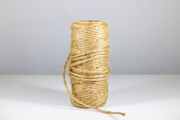 Roll of twine isolated on white background. Close up, selective focus.