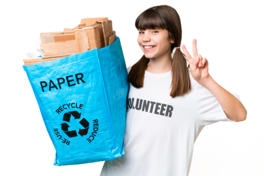 Little Caucasian girl holding a recycling bag full of paper to recycle over isolated background smiling and showing victory sign