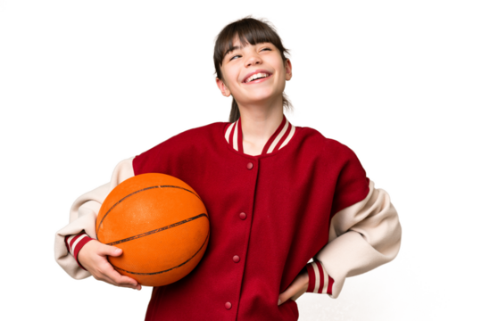 Little caucasian girl playing basketball over isolated background posing with arms at hip and smiling - Powered by Adobe