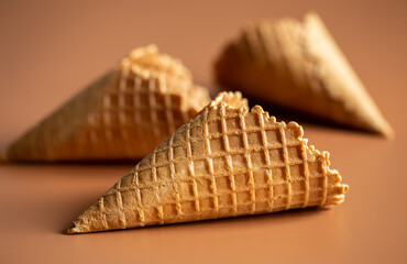 Close-up of waffle cones, creative macro concept of sweets and food.