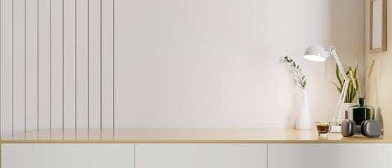 Mockup space on minimal wood tabletop with decor against the white wall. minimal workspace