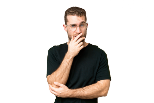 Young handsome blonde man over isolated chroma key background surprised and shocked while looking right