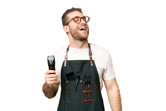 Barber man in an apron over isolated chroma key background laughing