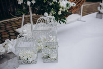 Wedding decor, candles in glass flasks in the forest.
